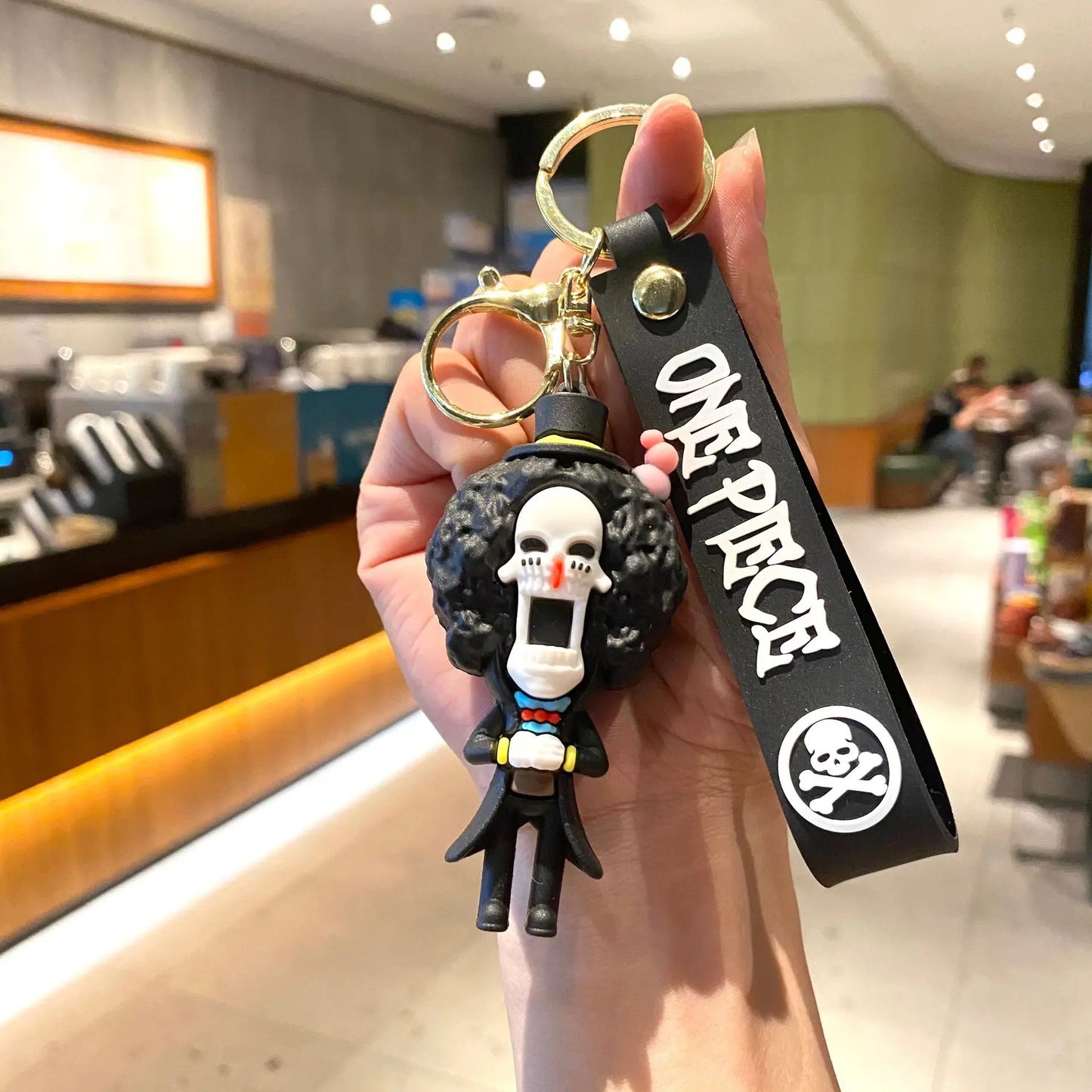 One Piece-cartoon-sleutelhanger – Brook op zwarte achtergrond
