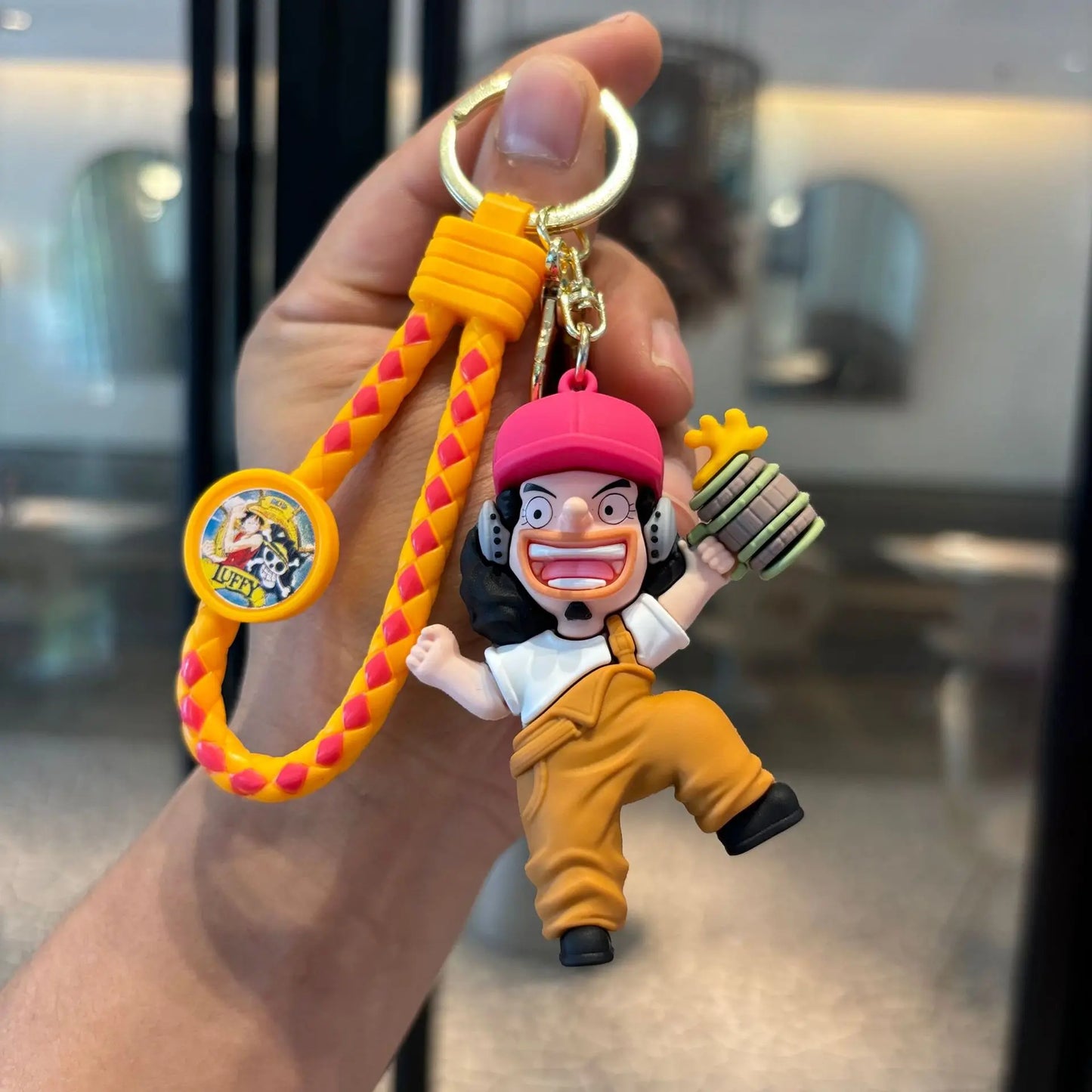 One Piece-figuursleutelhanger – Usopp in geel actiepak