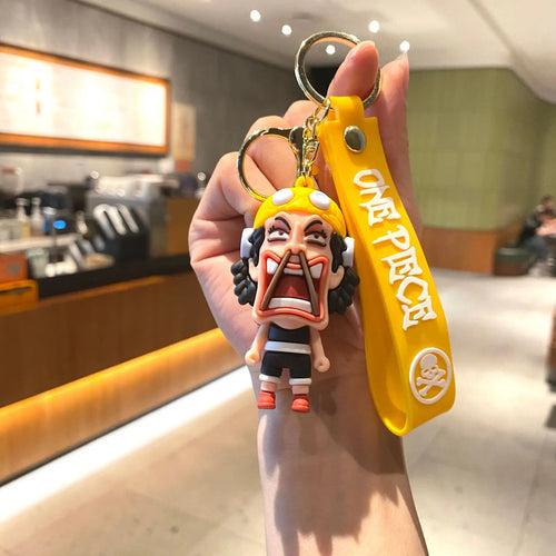 Cartoon-sleutelhanger van One Piece – Usopp met gele achtergrond