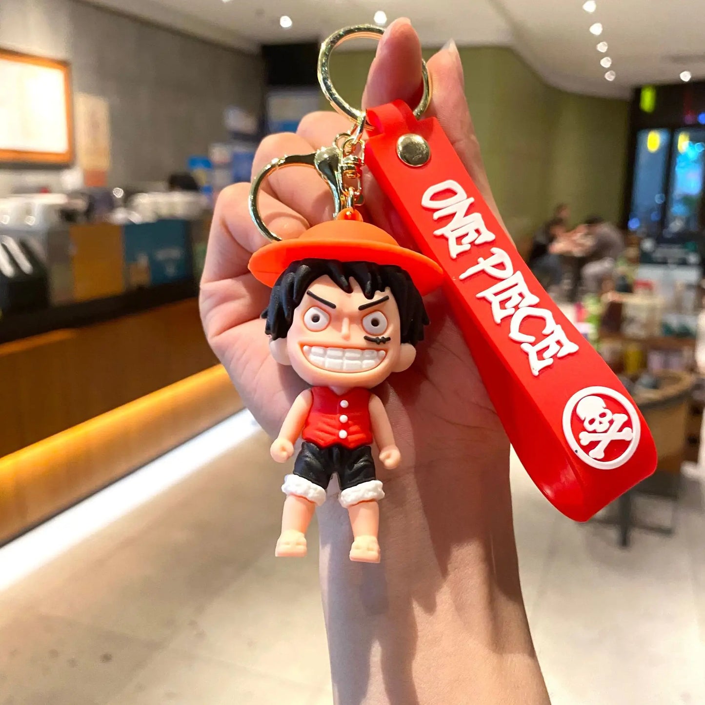 Cartoon-sleutelhanger van One Piece – Luffy met rode achtergrond